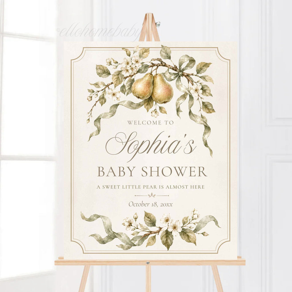 Close view of a sweet little pear welcome sign with sage-green ribbon and botanical watercolor artwork.