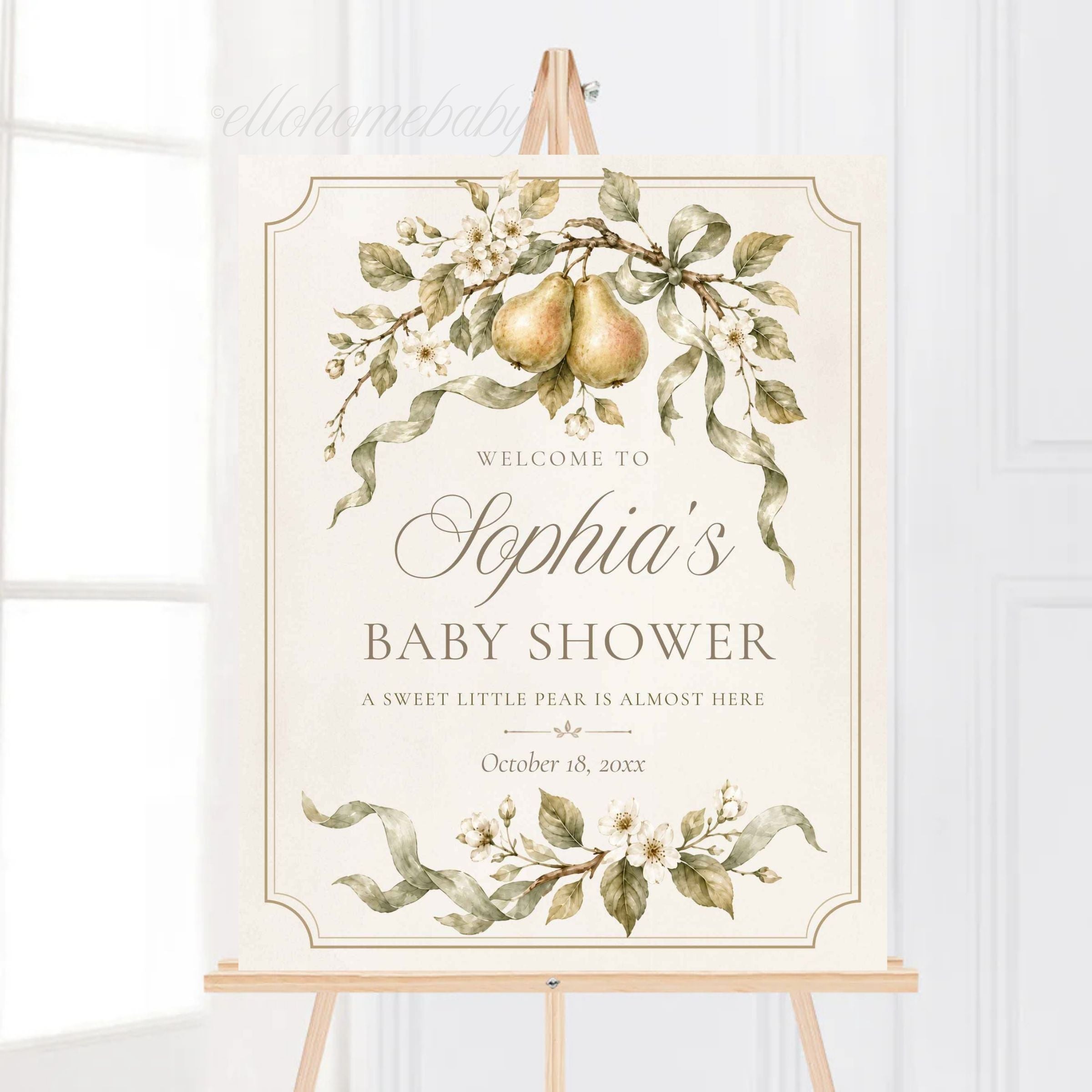 Close view of a sweet little pear welcome sign with sage-green ribbon and botanical watercolor artwork.