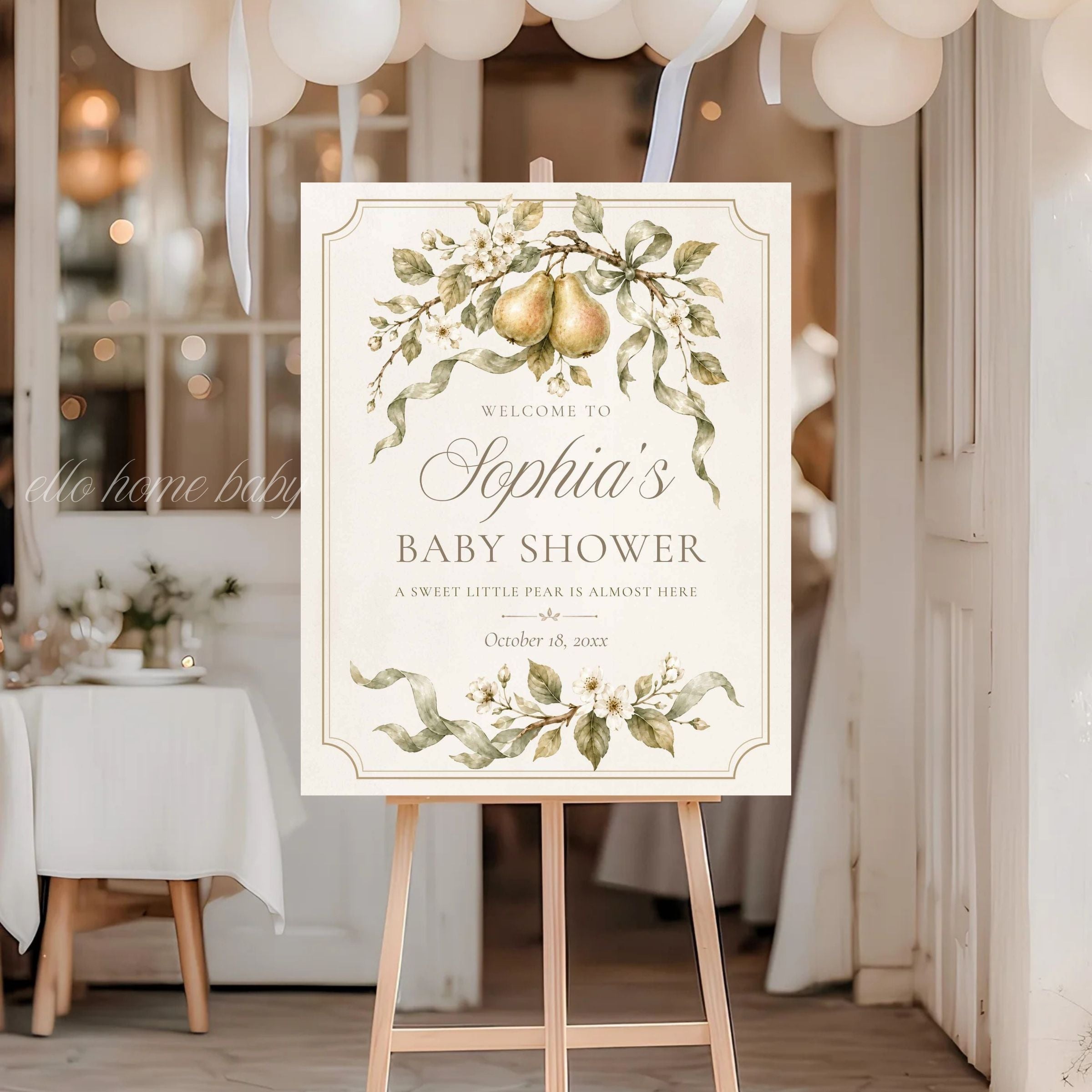 Pear baby shower welcome sign beneath white balloons at an elegant gender-neutral shower entrance.