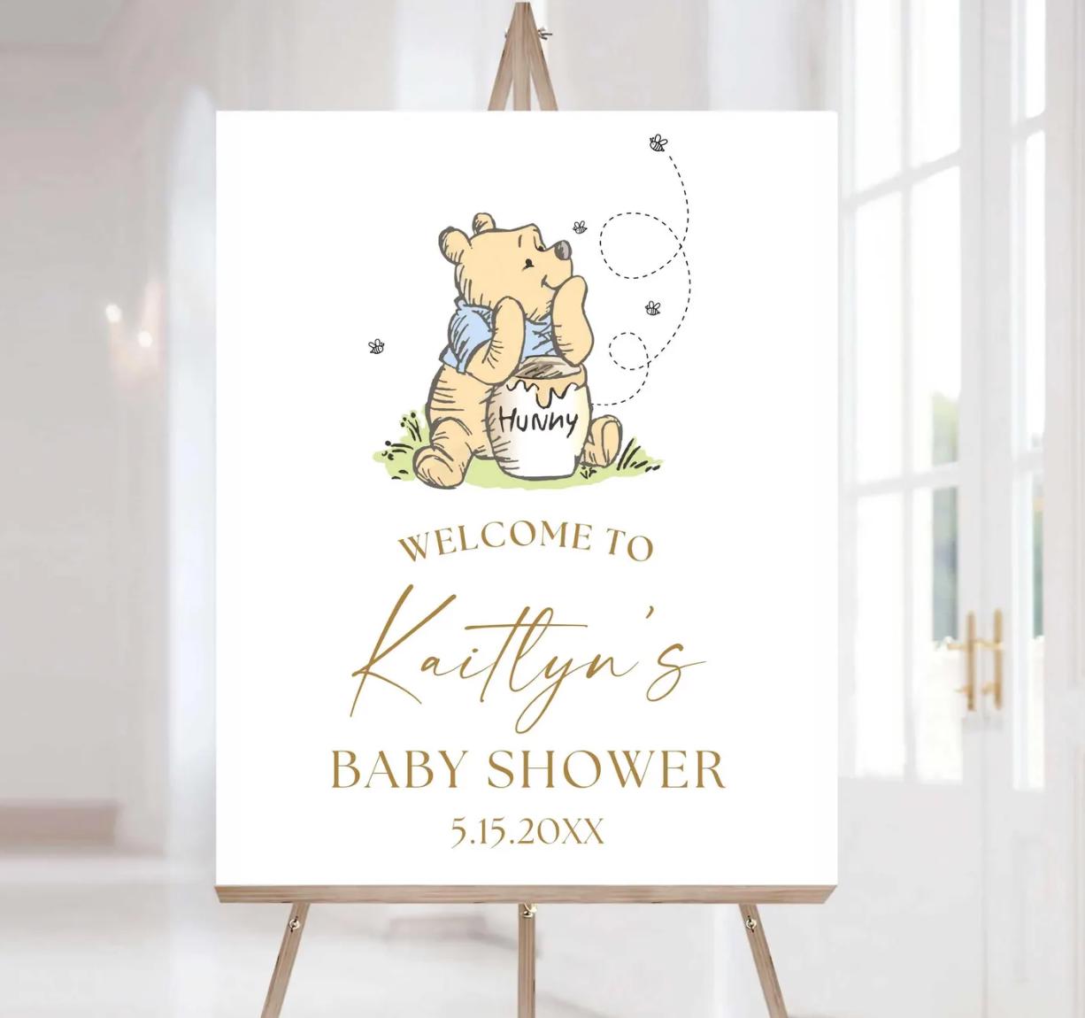 Another option available is pooh bear with a blue shirt placed on top with gold text. Baby shower or first birthday welcome sign.
