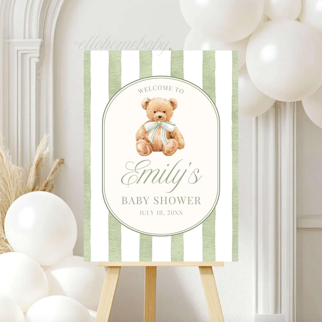 We Can Bearly Wait for you to welcome your guests with this Classic Teddy Bear baby shower welcome sign. Featuring a neutral soft teddy bear with a coquette bow and vintage sage green striped background, this design is perfect for a gender neutral shower, teddy bear theme party, classic storybook baby shower, first birthday party, or baby sprinkle events. This poster brings a sophisticated touch to your venue entrance.