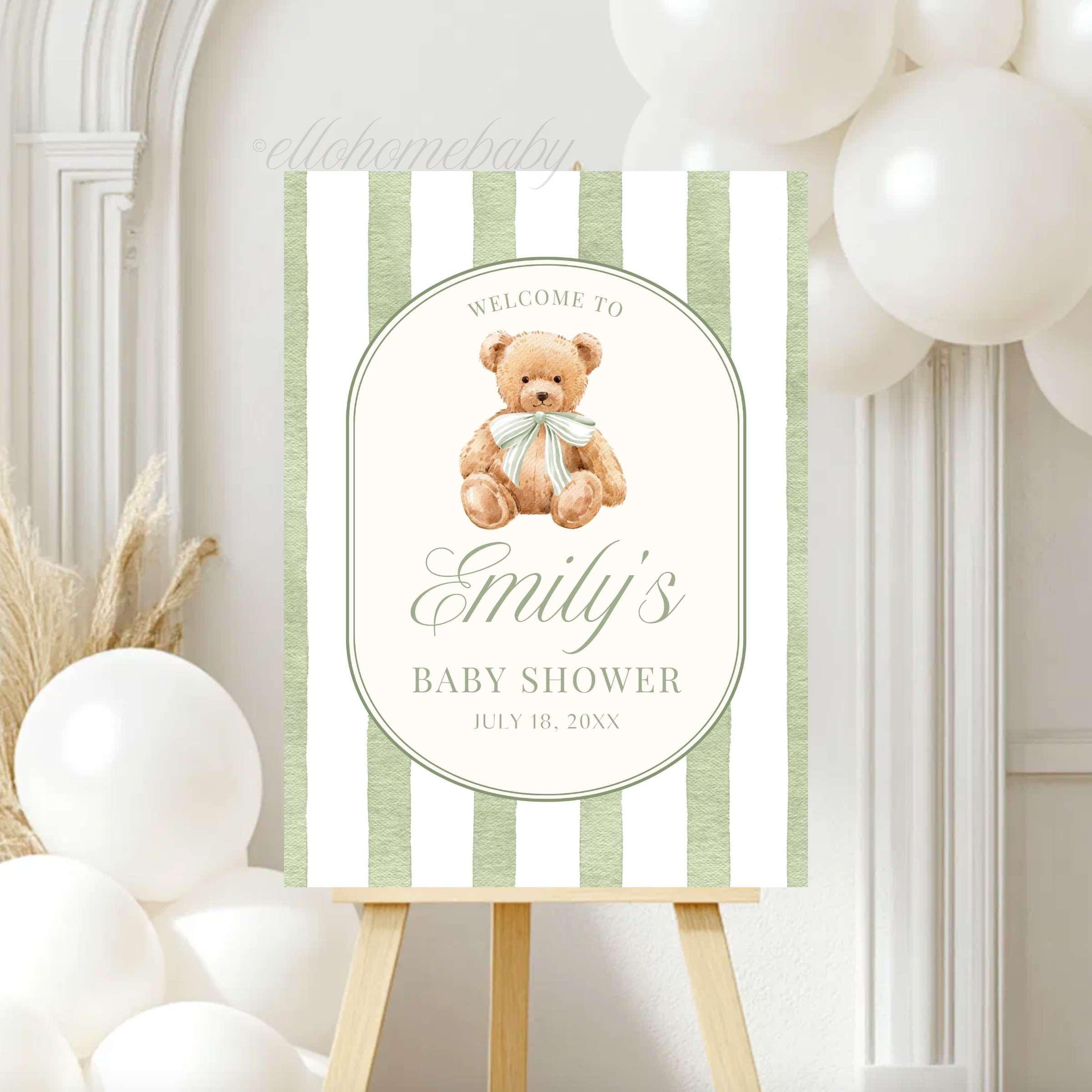 We Can Bearly Wait for you to welcome your guests with this Classic Teddy Bear baby shower welcome sign. Featuring a neutral soft teddy bear with a coquette bow and vintage sage green striped background, this design is perfect for a gender neutral shower, teddy bear theme party, classic storybook baby shower, first birthday party, or baby sprinkle events. This poster brings a sophisticated touch to your venue entrance.