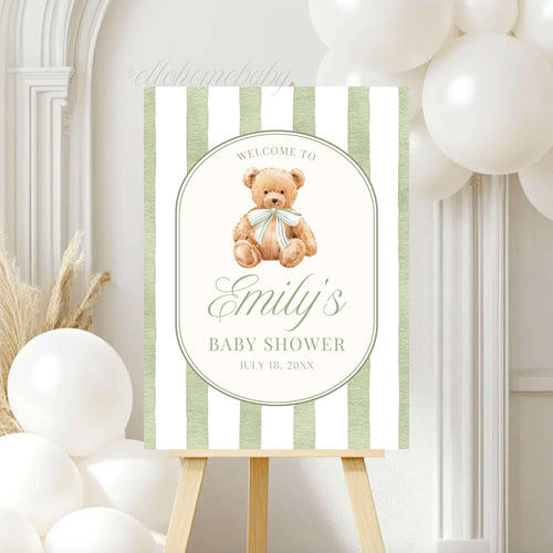 We Can Bearly Wait for you to welcome your guests with this Classic Teddy Bear baby shower welcome sign. Featuring a neutral soft teddy bear with a coquette bow and vintage sage green striped background, this design is perfect for a gender neutral shower, teddy bear theme party, classic storybook baby shower, first birthday party, or baby sprinkle events. This poster brings a sophisticated touch to your venue entrance.