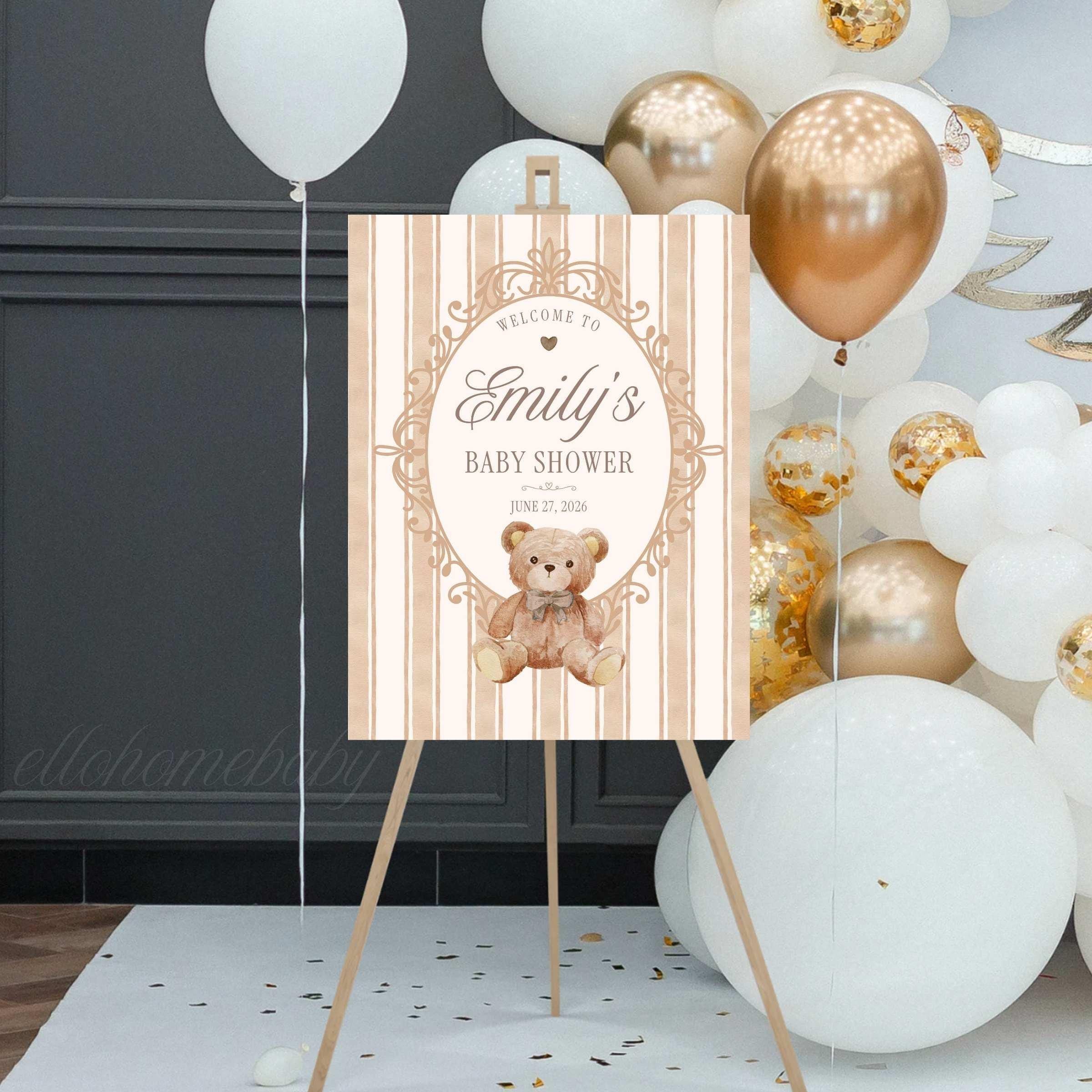 Vintage teddy bear themed baby shower welcome sign displayed on an easel with timeless neutral party décor.