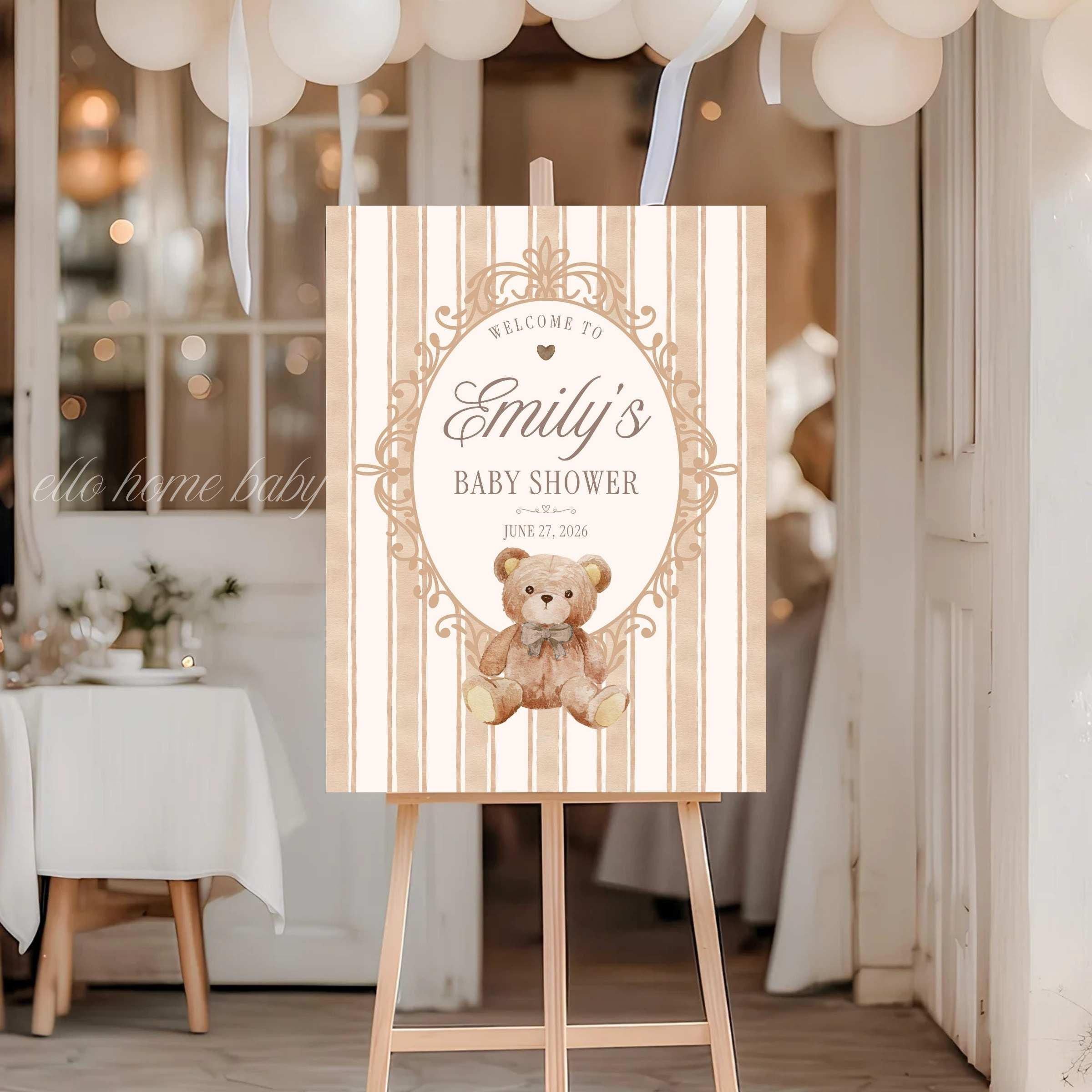 Watercolor teddy bear baby shower welcome sign on premium foam board with soft neutral striped background and classic heirloom frame.