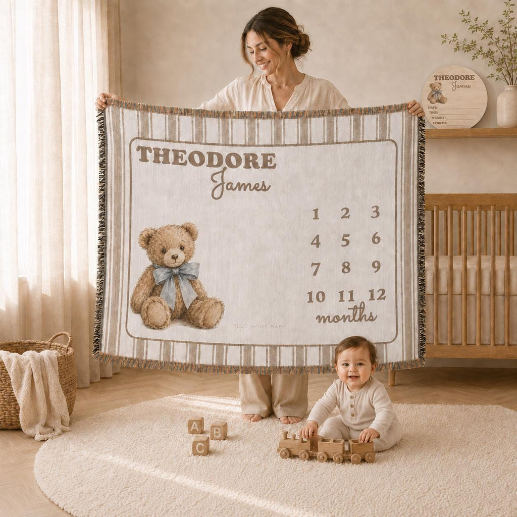 Mother displaying a fringed brown striped teddy bear milestone blanket personalized with first and middle name.