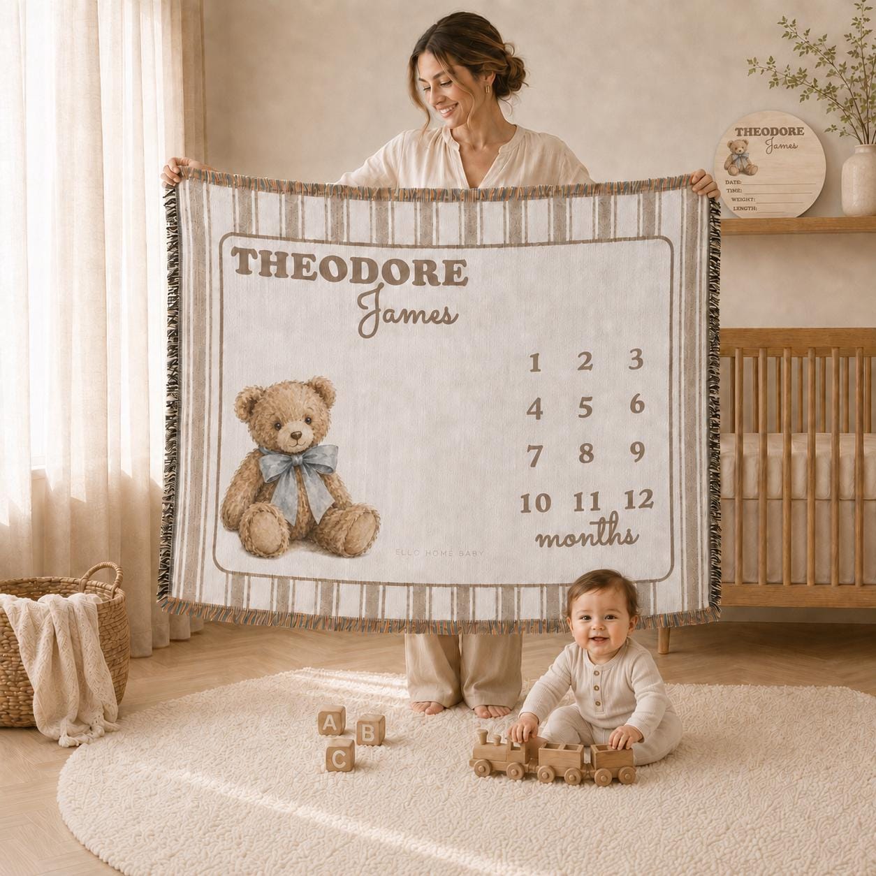 Mother displaying a fringed brown striped teddy bear milestone blanket personalized with first and middle name.