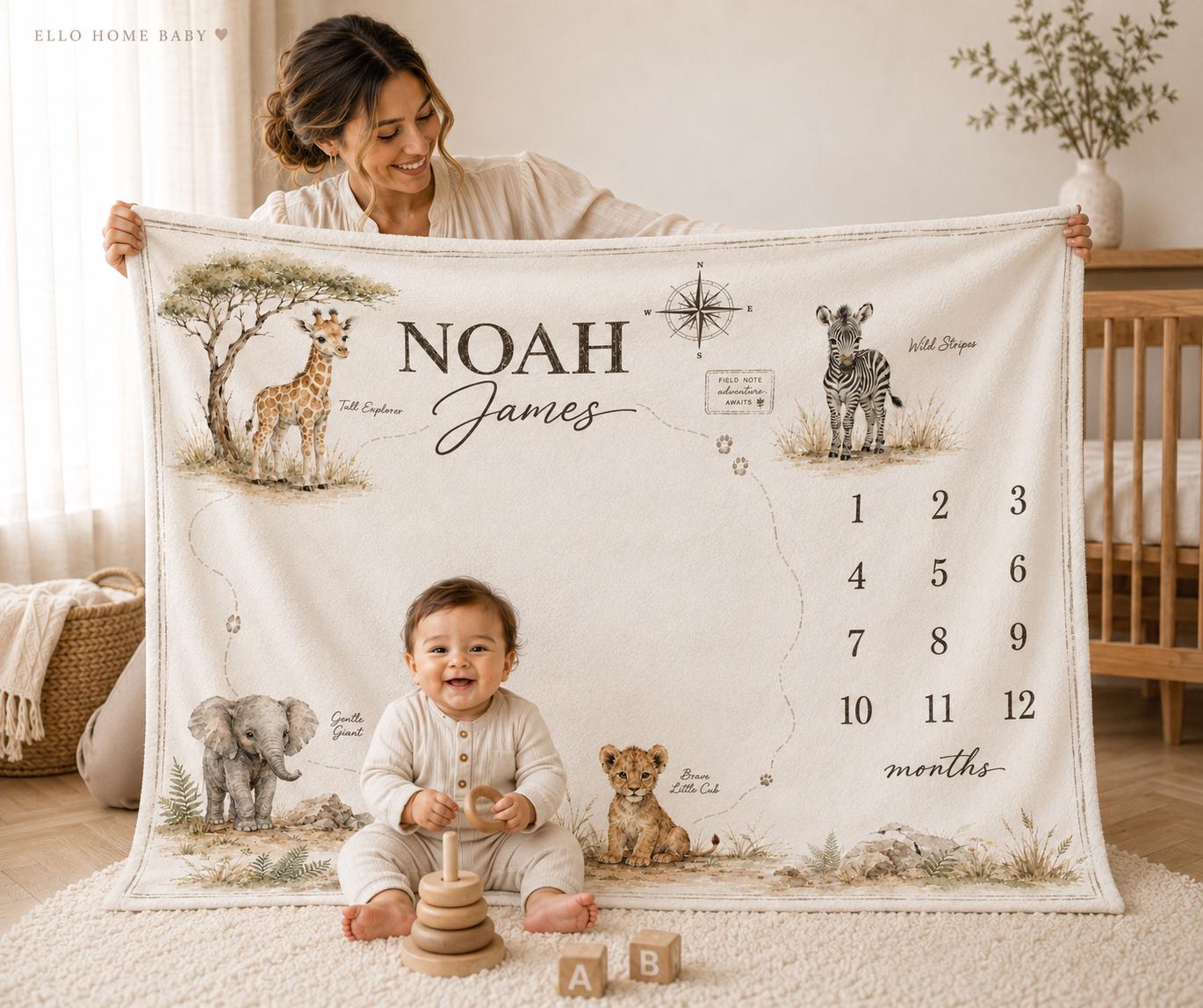 Mother holding a neutral safari map milestone blanket personalized with Noah James beside a smiling baby in a warm modern nursery.