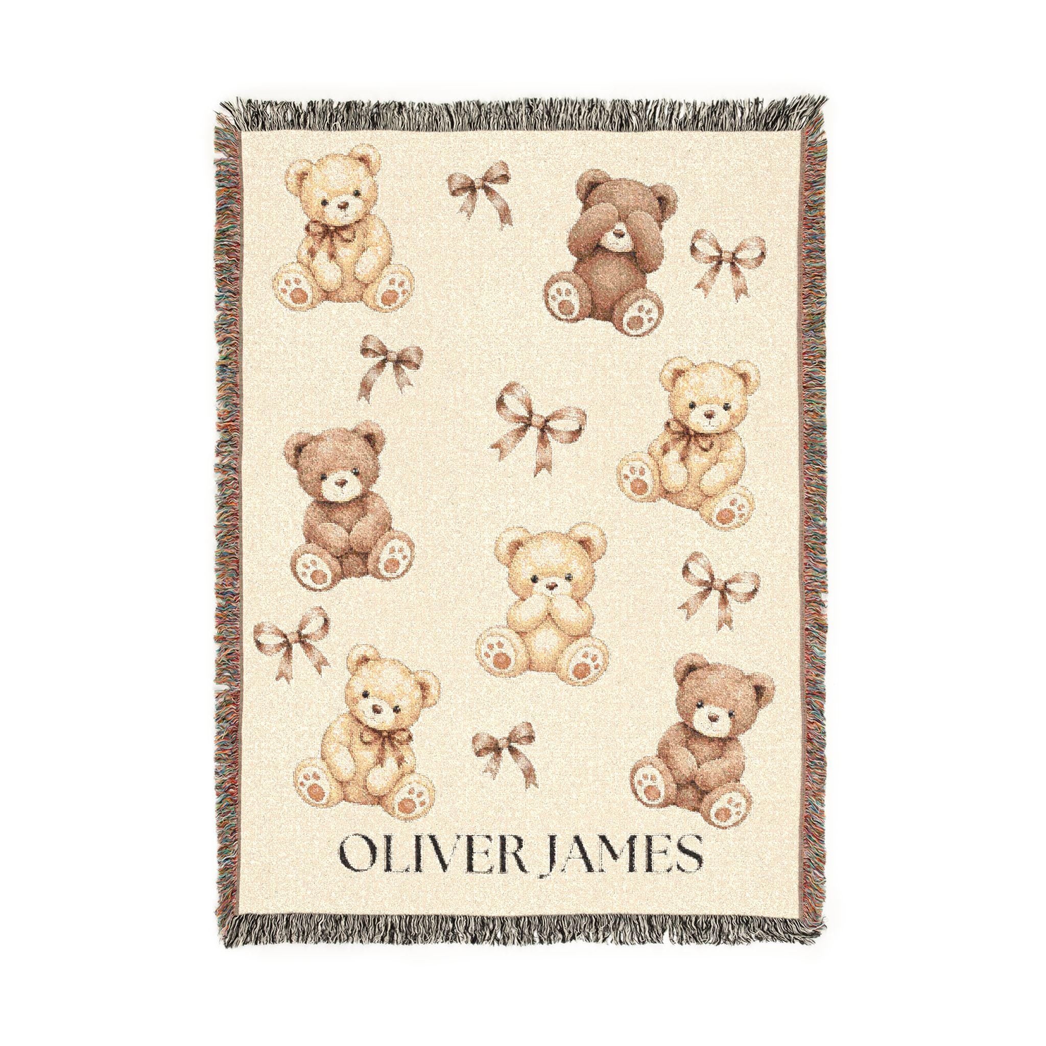 Close view of a custom teddy bear baby blanket showing interlaced woven threads, watercolor-style bears, warm beige yarn and multicolored fringe. This heirloom-quality gender neutral blanket blends beautifully into most nursery decor. Product Size is 52" x 37".