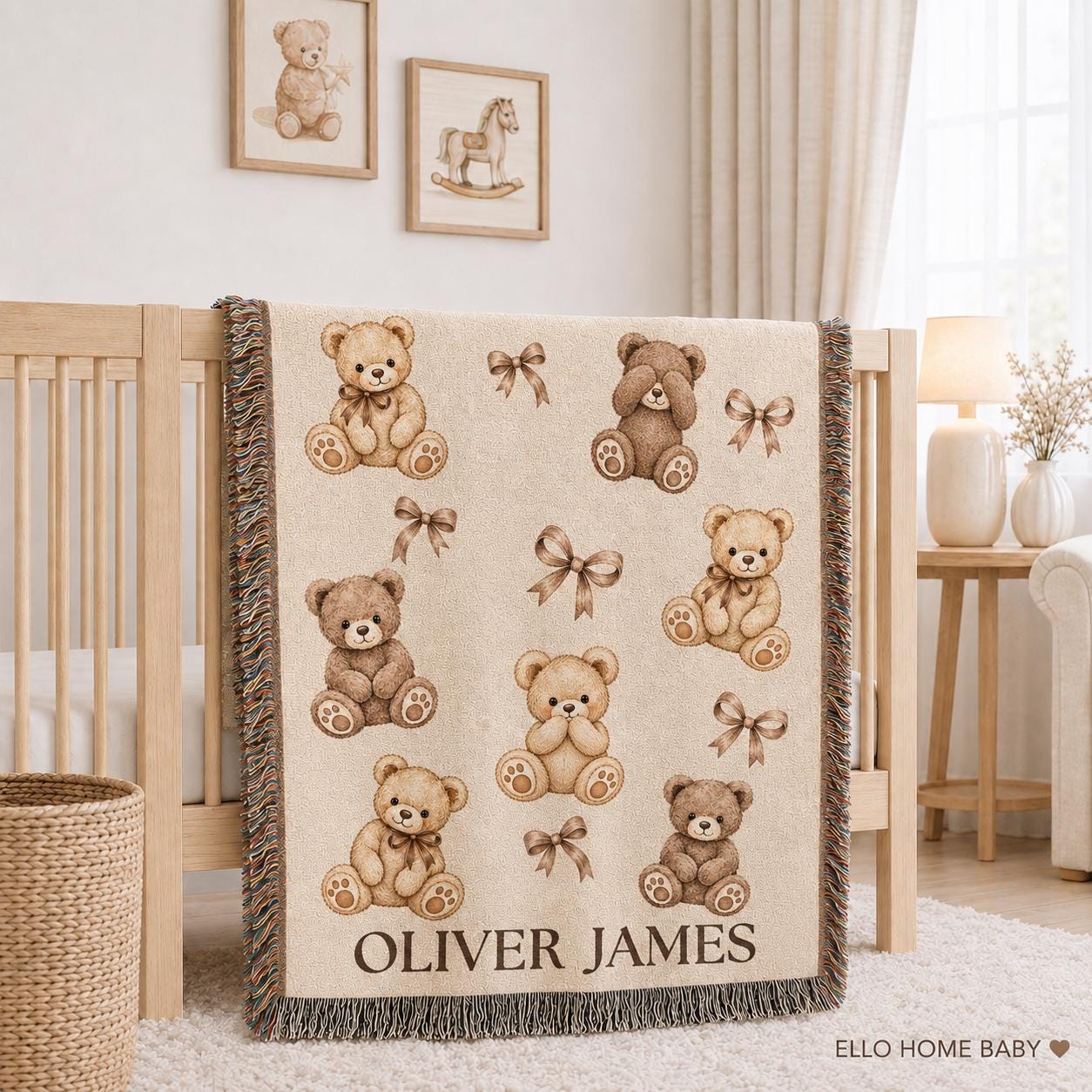 Personalized teddy bear woven baby blanket with cream and cocoa bears, taupe bows, custom name and fringed edges displayed on a natural wood nursery crib.